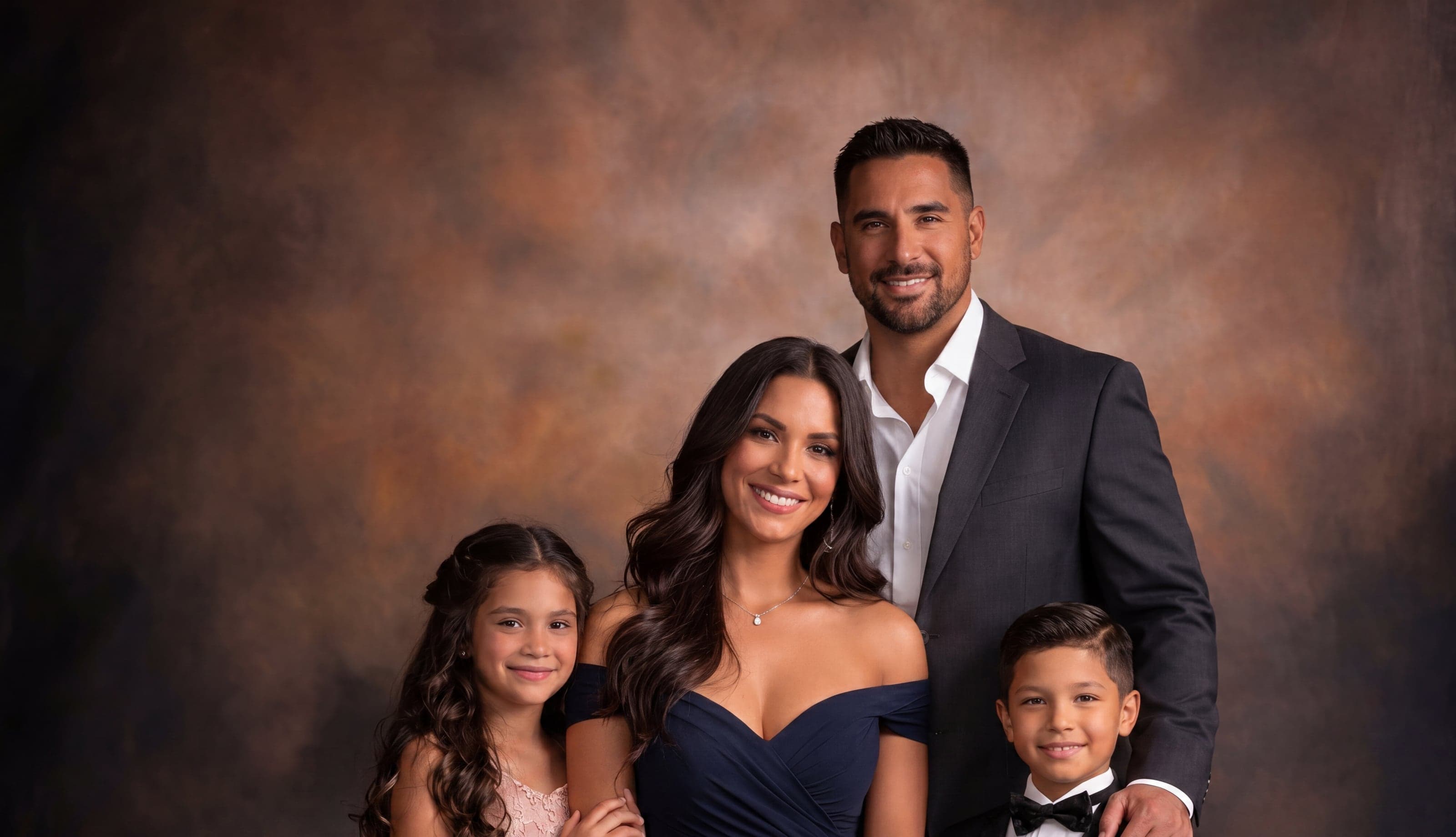 Elegantly dressed family in a fine-art studio portrait