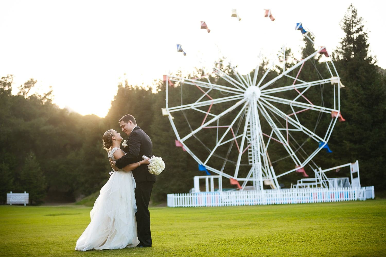 Kelly and John together at sunset beside the Calamigos Ranch Ferris wheel