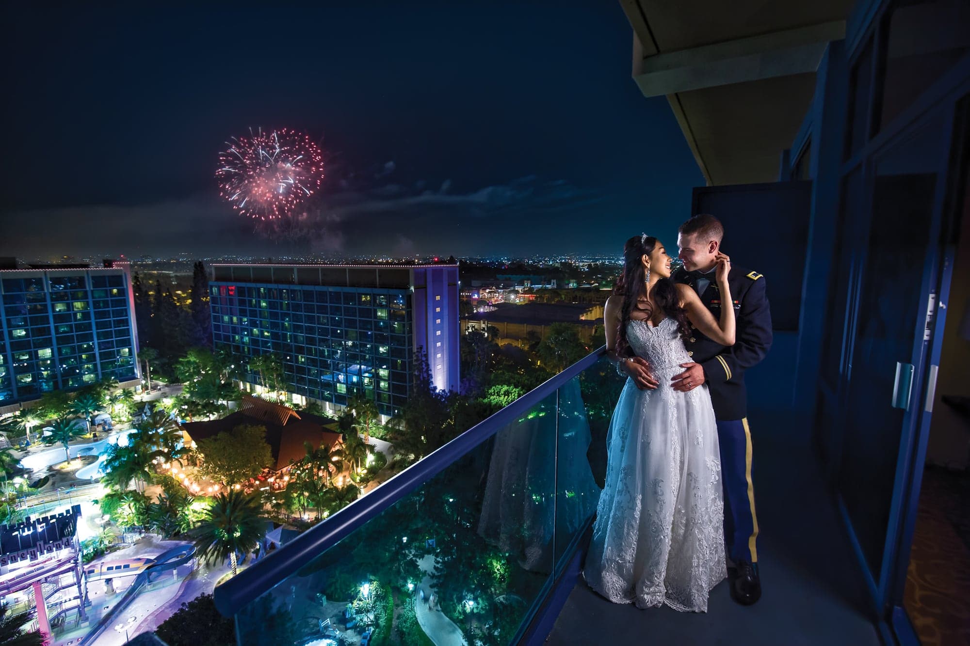 The Mann couple watching fireworks above the Disneyland Resort
