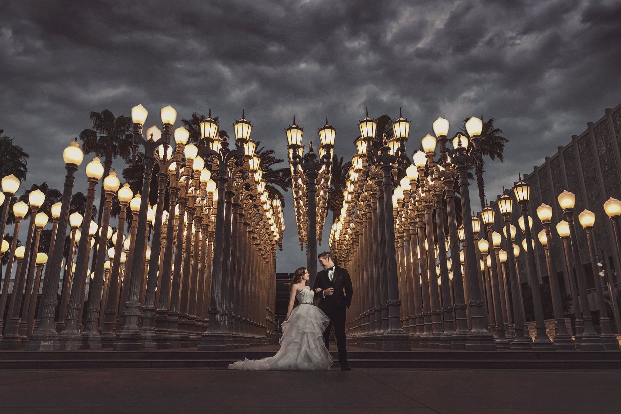 Kaila and Scott beneath the Urban Light installation at LACMA