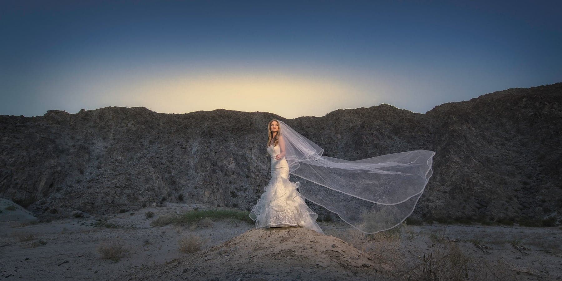 The Noterman bride with a sweeping veil in the Palm Springs desert