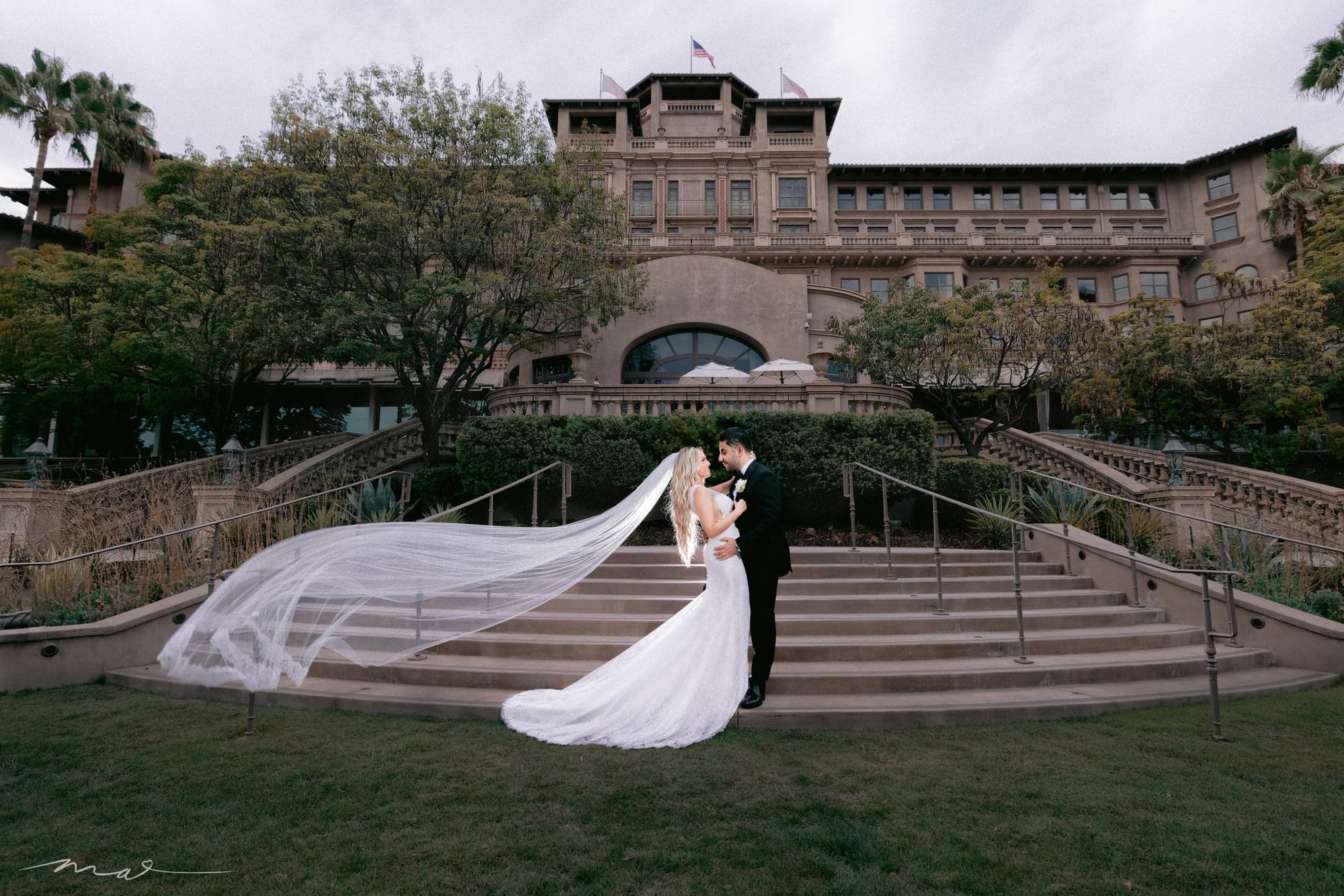 Melody and Hrand with a flowing veil outside The Langham Pasadena