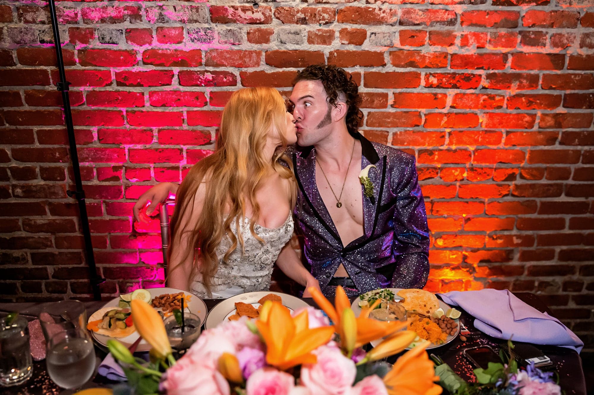 Jamie and Ramage sharing a kiss during their Hollywood reception