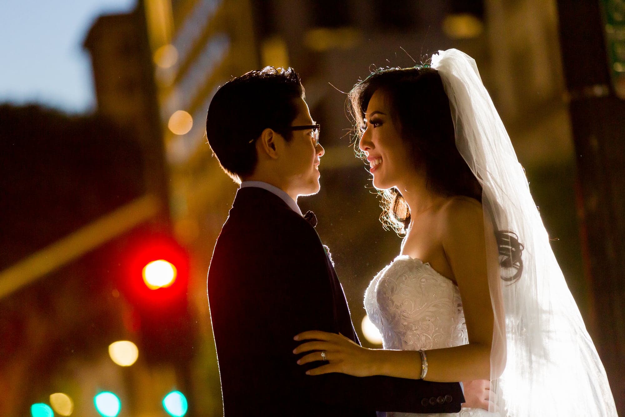 The Phan couple sharing a backlit portrait inside The Majestic Downtown