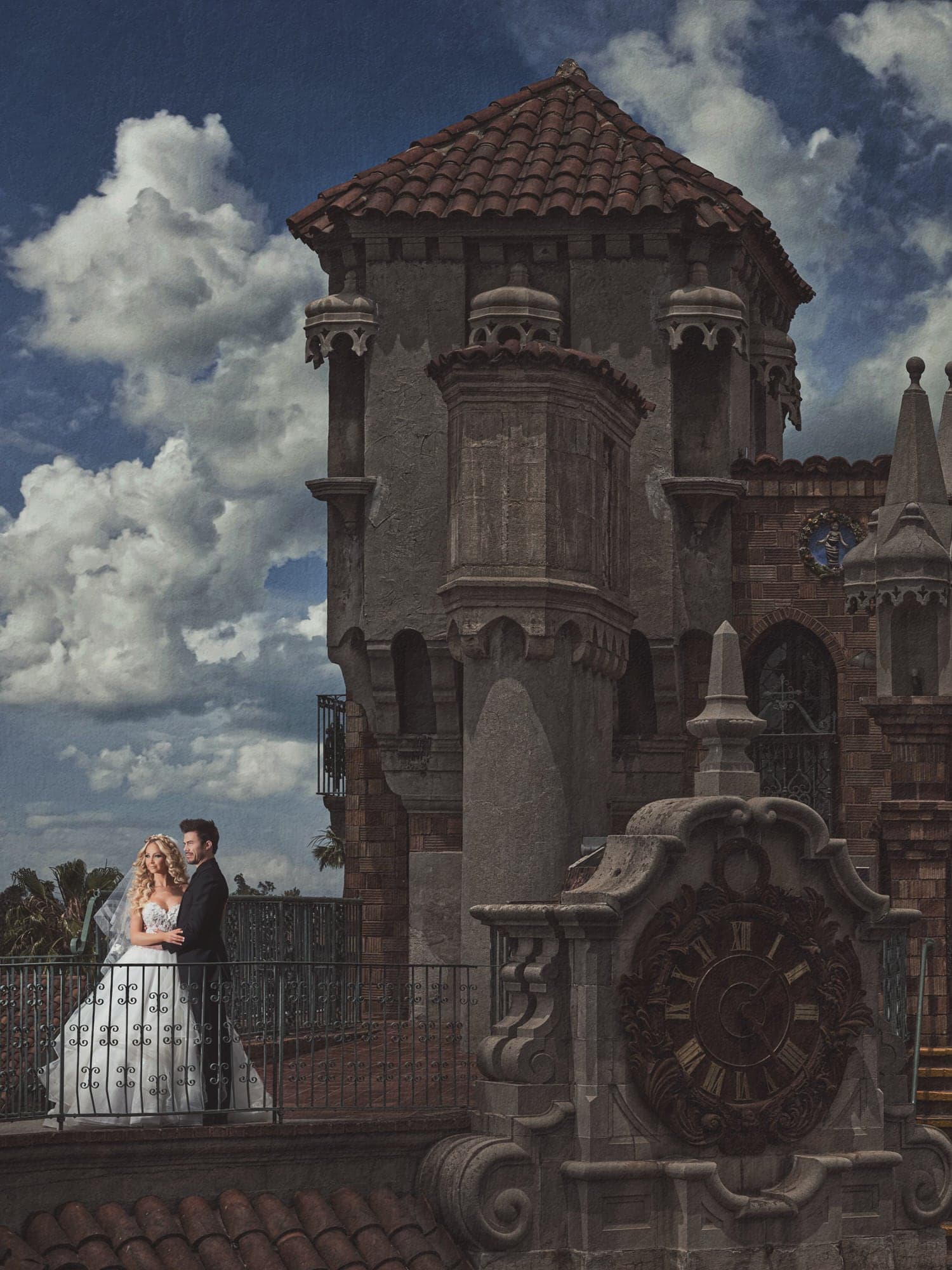 The Severen couple outside the Mission Inn beneath a dramatic sky