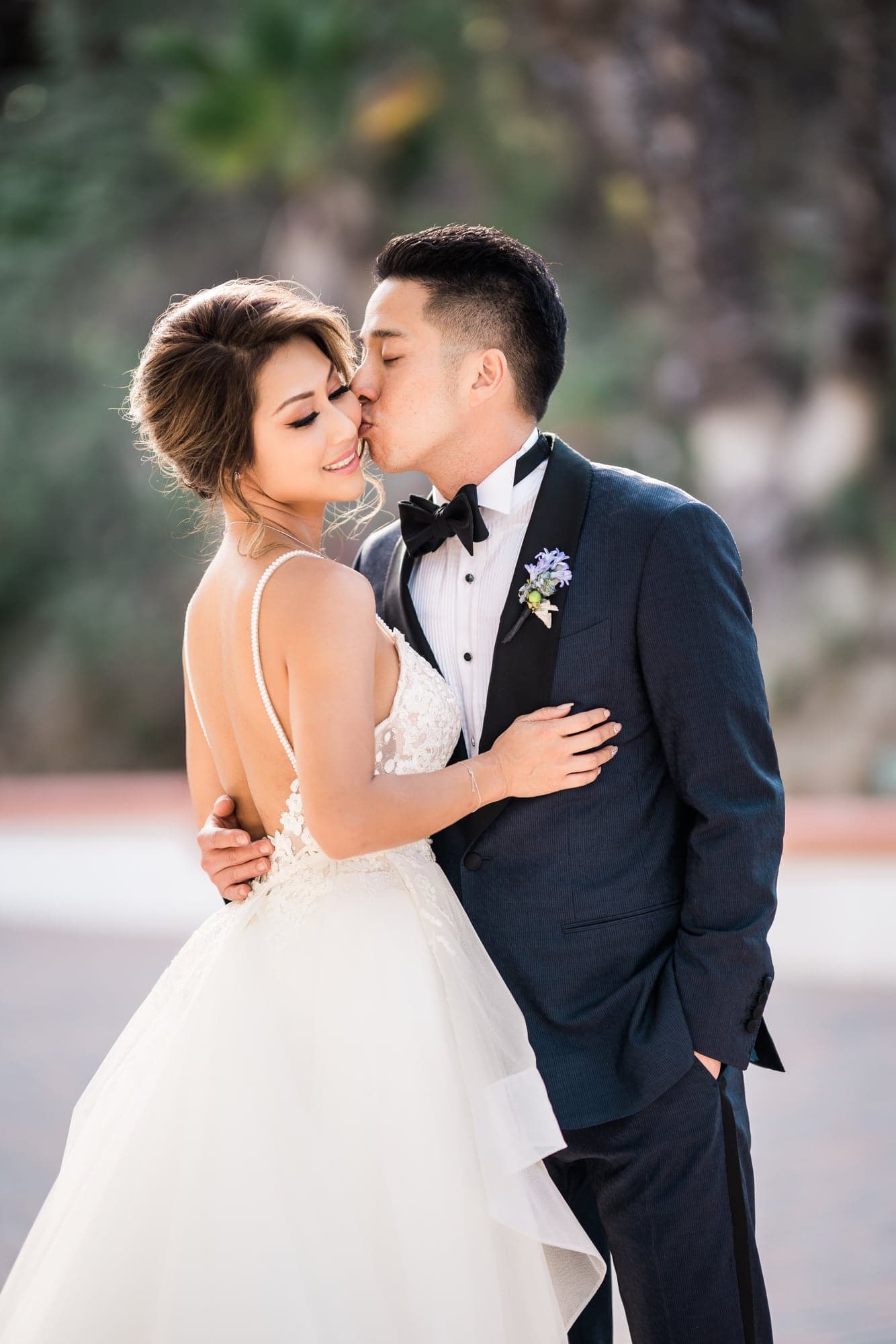 Anthony kissing Linda during their Rancho Las Lomas wedding portraits