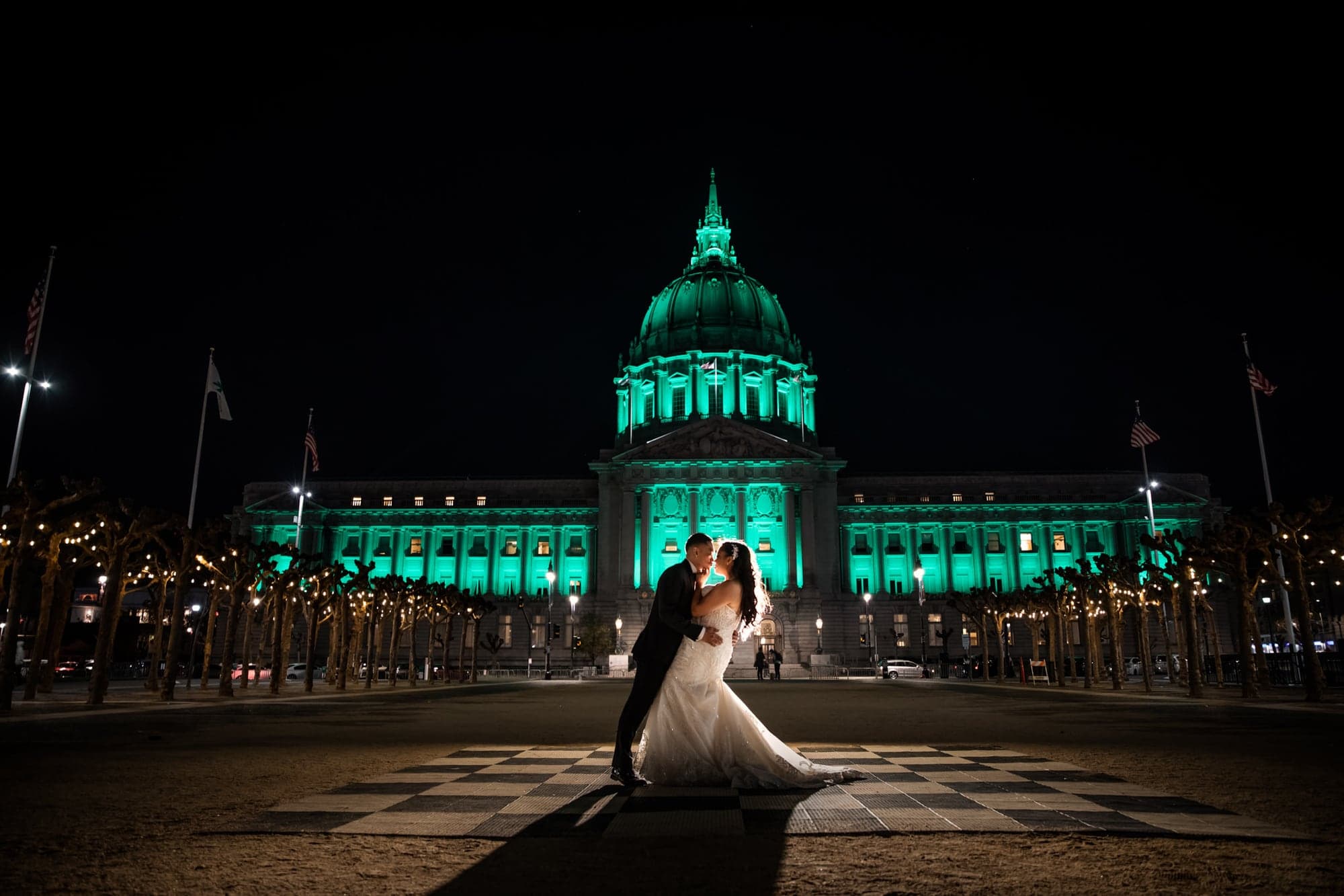 Cheryl and Rei outside San Francisco City Hall at night