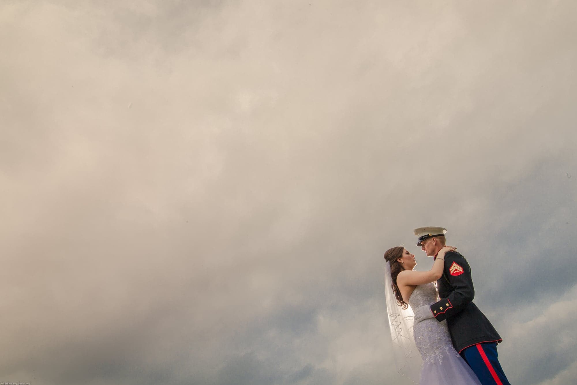 The Gootman newlyweds beneath a dramatic sky at Sand Canyon Ranch