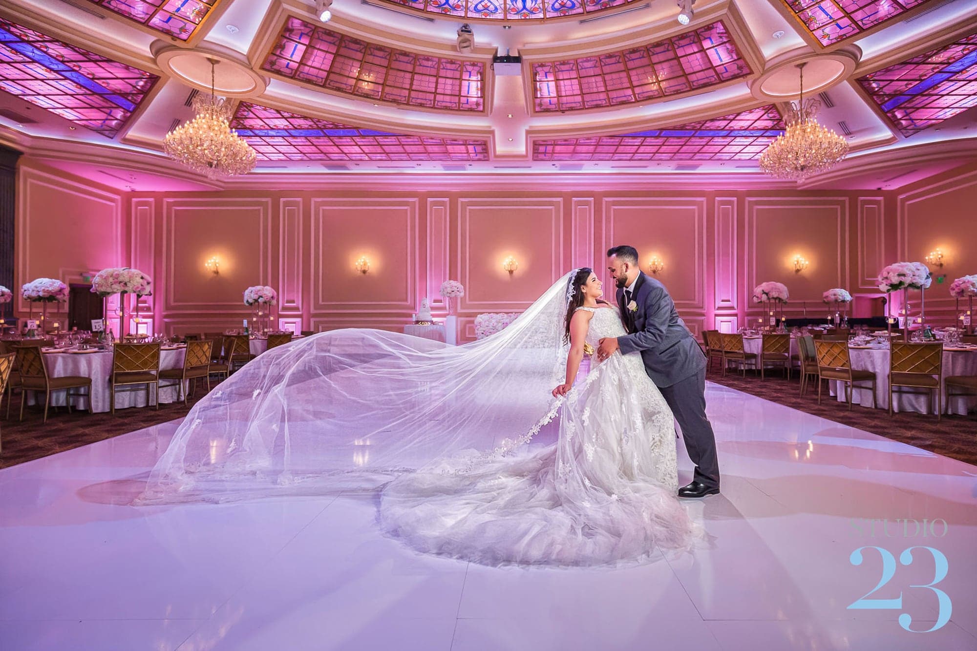 Marisol and Samuel beneath a flowing veil inside Taglyan Complex