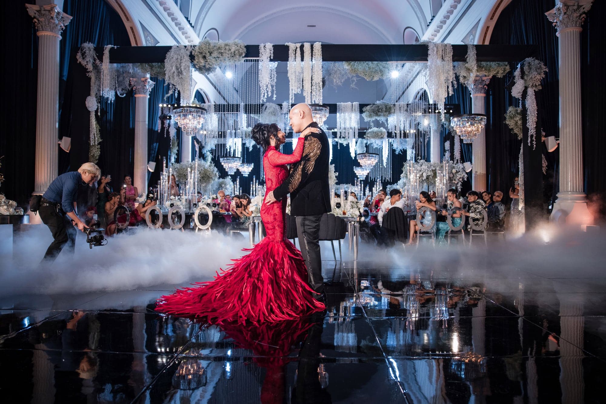 Afrika in a red reception gown dancing with Anthony through theatrical fog at Vibiana, photographed by Michael Anthony Photography