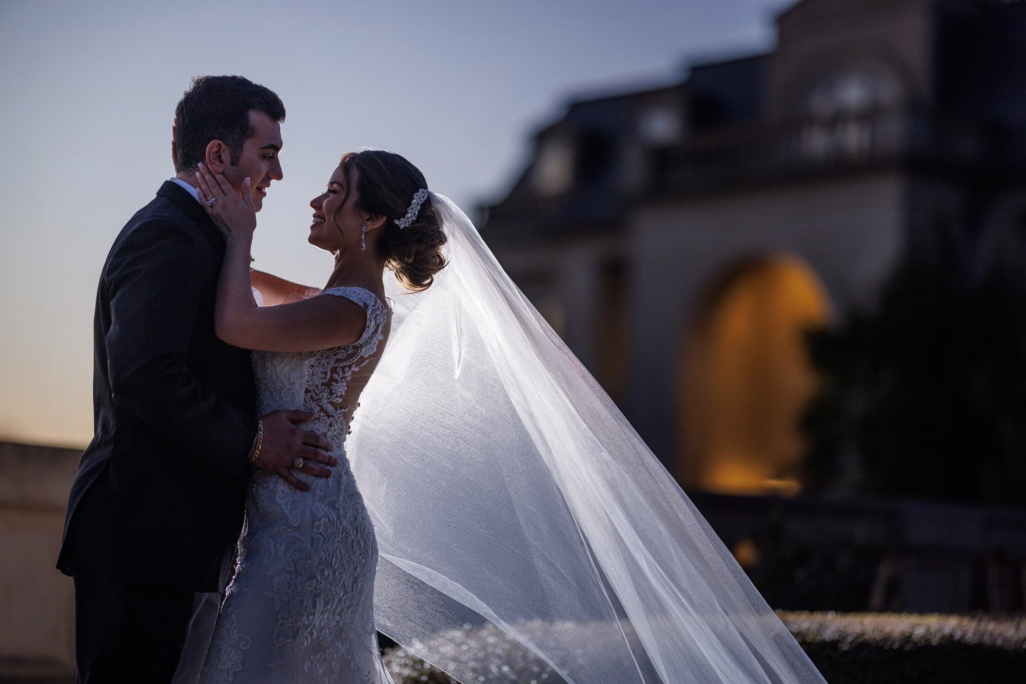 A grand chandelier-lit wedding reception, one of the venue archetypes couples choose across Dallas-Fort Worth