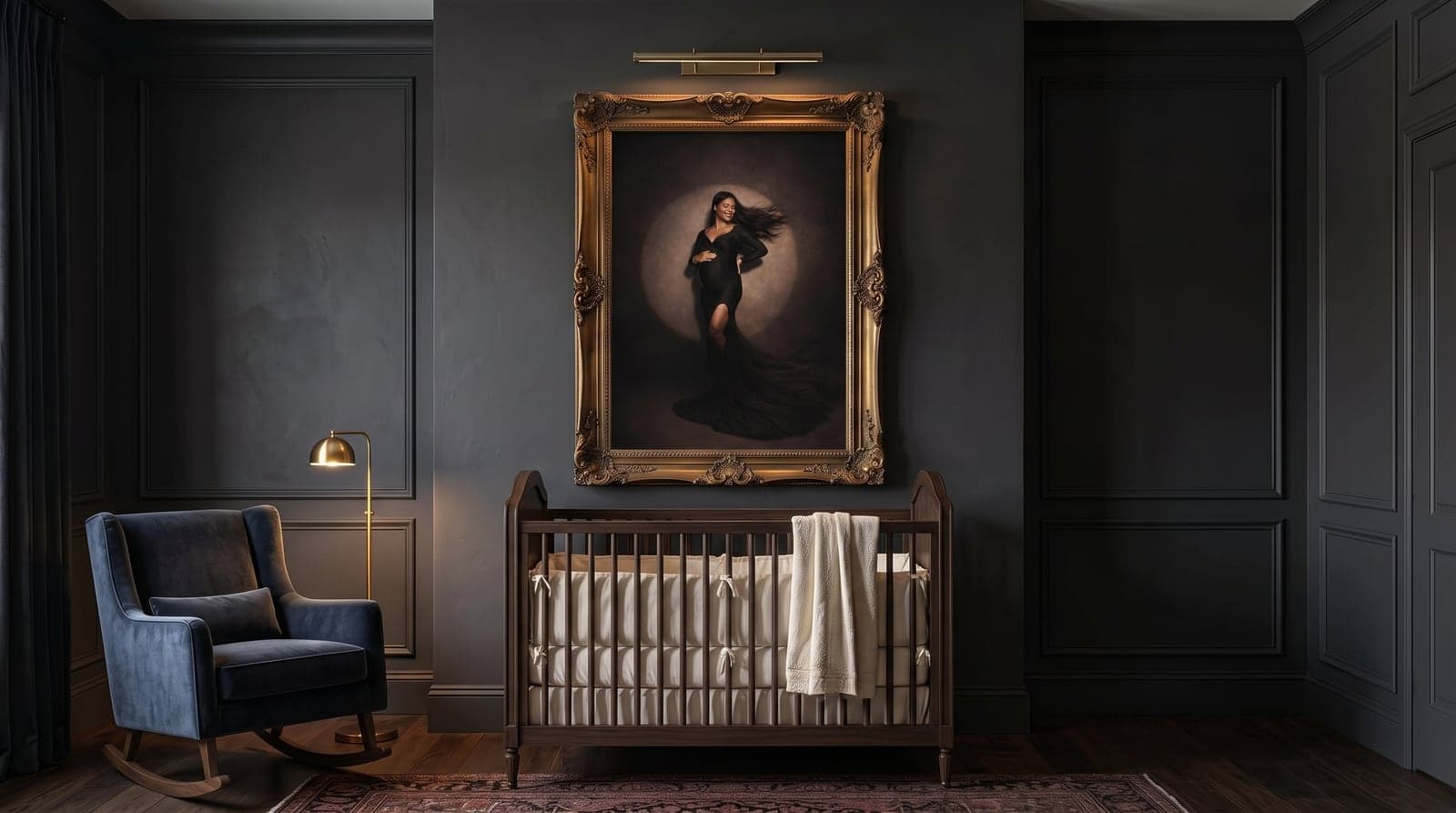 Gold-framed maternity portrait above a dark wood crib in a nursery