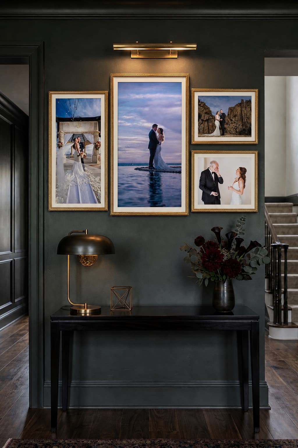 Four-piece Grand Solmar wedding wall collection with a brass gallery light above an entry console
