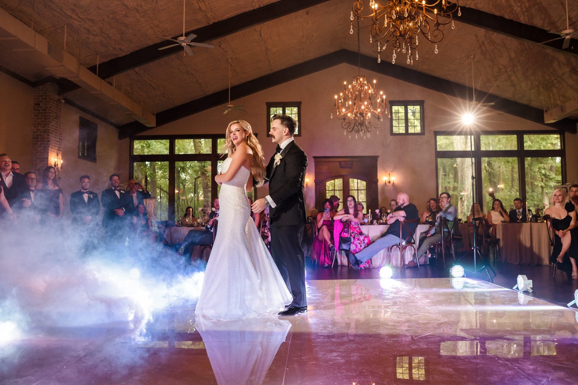 A first dance on a low cloud of fog at a North Texas wedding reception